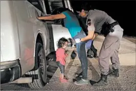  ?? JOHN MOORE/GETTY ?? A 2-year-old Honduran girl cries as her mother is detained last week near McAllen, Texas.