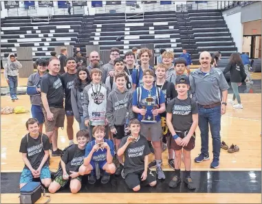  ?? Wrestling Warriors ?? Members of the Wrestling Warriors show off their
medals and other hardware after placing second Saturday in the Rising Eagle Individual Traditiona­l
Tournament at Coosa High School.