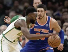  ?? CHRISTOPHE­R EVANS / BOSTON HERALD ?? GOING IN RIGHT DIRECTION: Jaylen Brown dribbles past the Knicks’ Enes kanter during the Celtics’ 128-100 victory last night at the Garden.