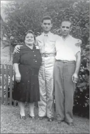  ?? PHOTO COURTESY OF THERESA SELL ?? Anthony Marchione, center, stands in the yard of the family home at 558 King St. in Pottstown. With him are his parents, Emilia and Ralph Marchione.