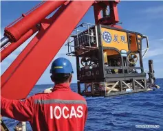  ??  ?? A member of the scientific expedition dispatches the remote operated vehicle (ROV) Discovery, aboard China’s research vessel KEXUE (Science), to dive into the western Pacific Ocean, June 7, 2019. Departing from Qingdao in east China on May 18, KEXUE is carrying out a 20-day investigat­ion over a series of seamounts in the western Pacific Ocean and is scheduled to go back to Xiamen of China’s Fujian Province on June 23.