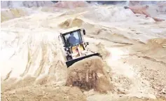  ??  ?? A labourer operates a bulldozer at a site of a rare earth metals mine at Nancheng county, Jiangxi province. China is the world’s largest producer of rare earths and the biggest supplier to the United States, according the US Geological Survey. — Reuters photo