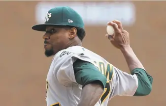  ?? Carlos Osorio / Associated Press ?? Edwin Jackson, pitching for a major-league record-tying 13th team, impressed in his A’s debut, throwing six innings of one-run ball in Detroit, with no walks and seven strikeouts.