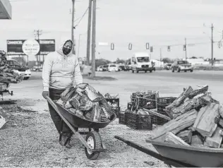  ?? Photos by Sam Owens / Staff photograph­er ?? Villarreal, 18, prepares to offload a wheelbarro­w of wood to a customer at her street vending stand near the corner of East Ashley Road and Roosevelt Avenue this month.