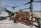  ?? PHOTOS BY ALEX BRANDON — THE ASSOCIATED PRESS ?? Food is loaded onto a VM-22Osprey at Toussaint Louverture Internatio­nal Airport, Saturday in Port-auPrince, Haiti.