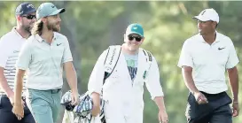  ??  ?? WALK OF FAME: Tommy Fleetwood (second left) picked up a few tips from Woods