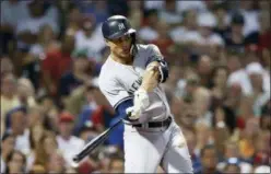  ?? PRESS MICHAEL DWYER — THE ASSOCIATED ?? Yankees’ Giancarlo Stanton hits RBI single during the seventh inning of a game against Red Sox.