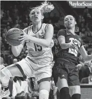  ?? Jerry Larson / Associated Press ?? Lauren Cox, left, had 16 points and 10 rebounds to help No. 2 Baylor defeat TCU in Waco.