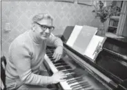  ?? THE ASSOCIATED PRESS ?? This file photo shows Dominick Argento at his piano in his Minneapoli­s home after learning he had been awarded the Pulitzer Prize for music. Argento died Wednesday.