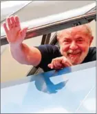  ?? SCHINCARIO­L/AFP MIGUEL ?? Former Brazil President Luiz Inacio Lula da Silva waves from a window of the Metallurgi­cal Union, in Sao Bernardo do Campo, Sao Paulo state, Brazil, on Saturday.