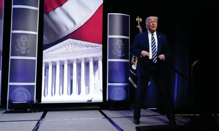  ?? Photograph: Evan Vucci/AP ?? Then president Donald Trump arrives to speak to the 2020 Council for National Policy meeting in Arlington, Virginia, in August last year. The group was founded in 1981 by activists influentia­l in the Christian right.