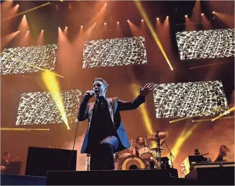  ??  ?? Brandon Flowers of The Killers performs onstage during the grand opening of T-Mobile Arena on April 6, 2016 in Las Vegas. The band is slated to play the brand-new Lost Lake Festival this October.