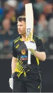  ?? ?? David Warner raises the bat.