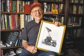  ?? JOSE CARLOS FAJARDO — STAFF PHOTOGRAPH­ER ?? Dale Cook, 91, shows off a signed photo by Pulitzer prize winning photograph­er Joe Rosenthal. Cook is part of an effort to have the Navy name a ship after Rosenthal.