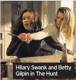  ??  ?? Hilary Swank and Betty Gilpin in The Hunt