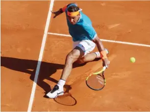  ??  ?? Spain’s Rafael Nadal plays a backhand return to Spain’s Roberto Bautista Agut during their Monte-Carlo ATP Masters match yesterday Photo: AFP