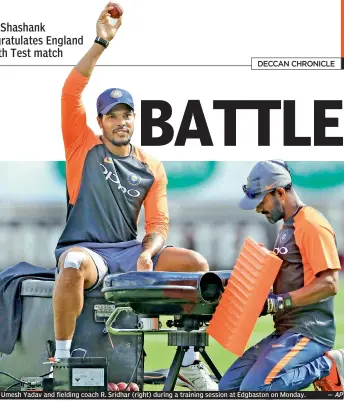  ?? — AP ?? Umesh Yadav and fielding coach R. Sridhar (right) during a training session at Edgbaston on Monday.