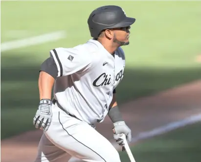  ?? AARON DOSTER/AP ?? The Sox’ Edwin Encarnacio­n follows the flight of his home run in the eighth inning Sunday against the Reds.