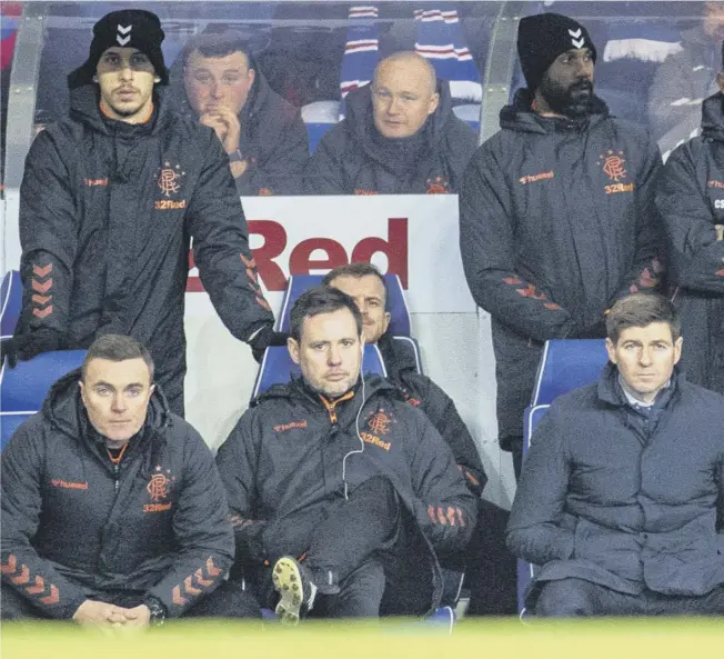  ??  ?? 0 The collection of glum faces in the dugout, with manager Steven Gerrard front right, reflects the mood in the Rangers camp during Wednesday’s 1-0 defeat by Hamilton.