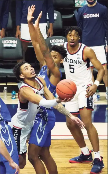  ?? David Butler II / Pool Photo via AP ?? UConn’s James Bouknight makes a basket against Creighton in the second half on Sunday. Bouknight finished with a career-high 40 points in the overtime loss.