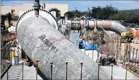  ??  ?? PIPES installed in San Marcos, 10 miles inland from the Carlsbad plant, will bring desalinate­d water into the San Diego CountyWate­r Authority’s network.