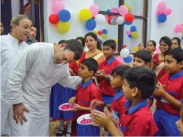  ?? — PTI ?? Congress chief Rahul Gandhi interact with schoolkids during the opening ceremony of a private school in Amethi on Tuesday.