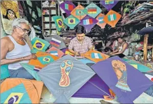  ?? PTI ?? The World Cup is not just the greatest sporting event, but also a coming together of peoples like no other. For Indians who aren’t represente­d, a team picked from the 32 becomes a new point of passion. A vendor in Kolkata has designed his kites in an...