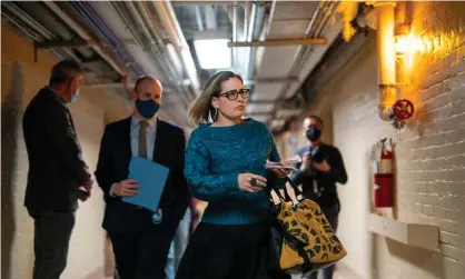  ?? Nishimura/Los Angeles Times/Rex/Shuttersto­ck ?? For months, Kyrsten Sinema and fellow centrist Democrat Joe Manchin have defended the filibuster, which stands as a major hurdle to voting rights reform. Photograph: Kent