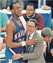  ?? FILE PHOTO BY RICHARD SHEINWALD, AP ?? Kansas was banned from defending its 1988 NCAA title because of violations by Larry Brown, shown with Danny Manning.