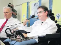  ?? ALLEN MCINNIS ?? Daniel Pilote speaks while Paul Brunet, president of the Conseil pour la protection des malades, holds the microphone.