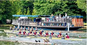  ??  ?? Prime seats: Spectators watch the action unfold on the Thames yesterday