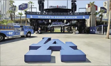  ?? Photograph­s by Wally Skalij Los Angeles Times ?? THE BLEACHERS have long been a popular spot at Dodger Stadium, but now fans can enter through a center-field plaza between them.