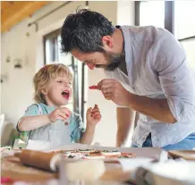  ?? Getty ?? Co-parenting can entail preparing and feeding meals