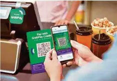  ??  ?? APLIKASI GrabPay menjadi lebih meluas di seluruh negara.