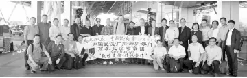  ??  ?? Standing from sixth left, Yeh, Hwong, Liew, Teo, Tee, Lau (eighth right) and the delegates take a group photo before heading for the departure hall.