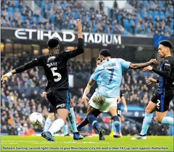  ??  ?? Raheem Sterling (second right) shoots to give Manchester City the lead in their FA Cup clash against Rotherham