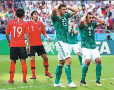  ??  ?? Germany's Mario Gomez (left) and Mats Hummels can’t believe it after seeing another chance fly wide during the World Cup holder’s stunning 2-0 tournament-ending loss to South Korea in Kazan on Wednesday.