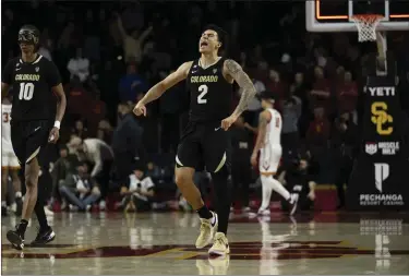  ?? KYUSUNG GONG — THE ASSOCIATED PRESS ?? Colorado guard KJ Simpson reacts after the team’s 92-89win over USC in double overtime on Saturday in Los Angeles.