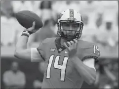  ?? The Associated Press ?? IN A RHYTHM: Oklahoma State quarterbac­k Taylor Cornelius throws Saturday in the first half of a 44-21 win against Boise State in Stillwater, Okla.