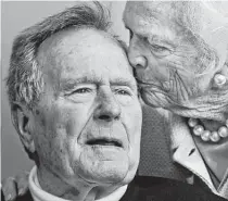  ?? Charles Krupa / Associated Press ?? George H.W. and Barbara Bush share a tender moment on June 12, 2012, at the family compound in Kennebunkp­ort, Maine.