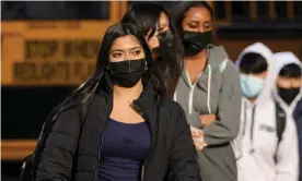  ?? ?? Students leave Washington-Liberty High School in Arlington county, one of several school districts that sued to stop Youngkin’s mask-optional order. Photograph: Evelyn Hockstein/ Reuters