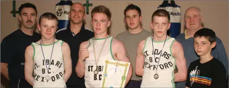  ??  ?? The St. Ibar’s-St. Joseph’s contingent after the Leinster youths championsh­ips (from left): BillyWalsh (coach), Joe Bridges (runner-up), Damien Godkin (coach), Darren Butler (Leinster champion), Tomás Whelan (coach), Barry O’Neill (runner-up), LiamWalsh R.I.P. (coach), RyanWalsh.