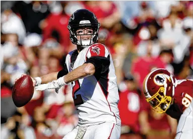  ?? GETTY IMAGES ?? Through eight games, quarterbac­k Matt Ryan has thrown for more yards, as many touchdowns and fewer intercepti­ons than at the same point in his MVP season two years ago when he took the Falcons to the Super Bowl.