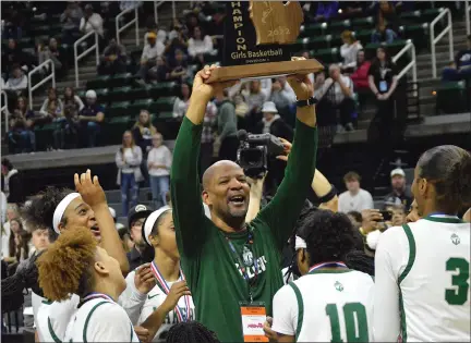  ?? MATTHEW B. MOWERY — MEDIANEWS GROUP FILE PHOTO ?? West Bloomfield coach Darrin McAllister (center) raises the Division 1champions­hip trophy after the Lakers beat Hartland in the 2022D1 finals to clinch the program’s first state title.