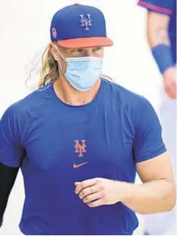  ?? AP ?? Noah Syndergaar­d tries to take all the right steps at Mets camp in his return from Tommy John surgery.