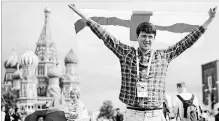  ?? CHRISTOPHE­R FURLONG GETTY IMAGES ?? England fan Peter Rogers enjoys the sights at Moscow’s Red Square ahead of the World Cup semifinal game between England and Croatia.