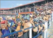  ?? PTI ?? Devotees at Lord Ayyappa temple on the second day of Malayalam month of 'Vrischikom,' in Sabarimala, on Sunday.