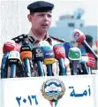  ??  ?? Interior Ministry’s spokesman Brigadier Adel Al-Hashash addresses reporters outside the elections affairs department.