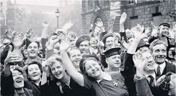  ??  ?? Seizing the moment: VE Day crowds in high spirits in London in 1945
