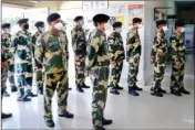  ??  ?? BSF personnel wear protective masks in view of coronaviru­s pandemic at a check-up camp, BSF hospital, in Jammu, on Sunday